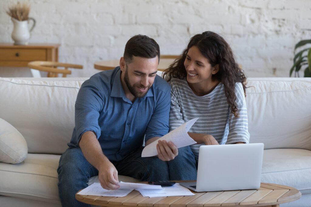 Couple reviewing timeshare paperwork | Donating a timeshare