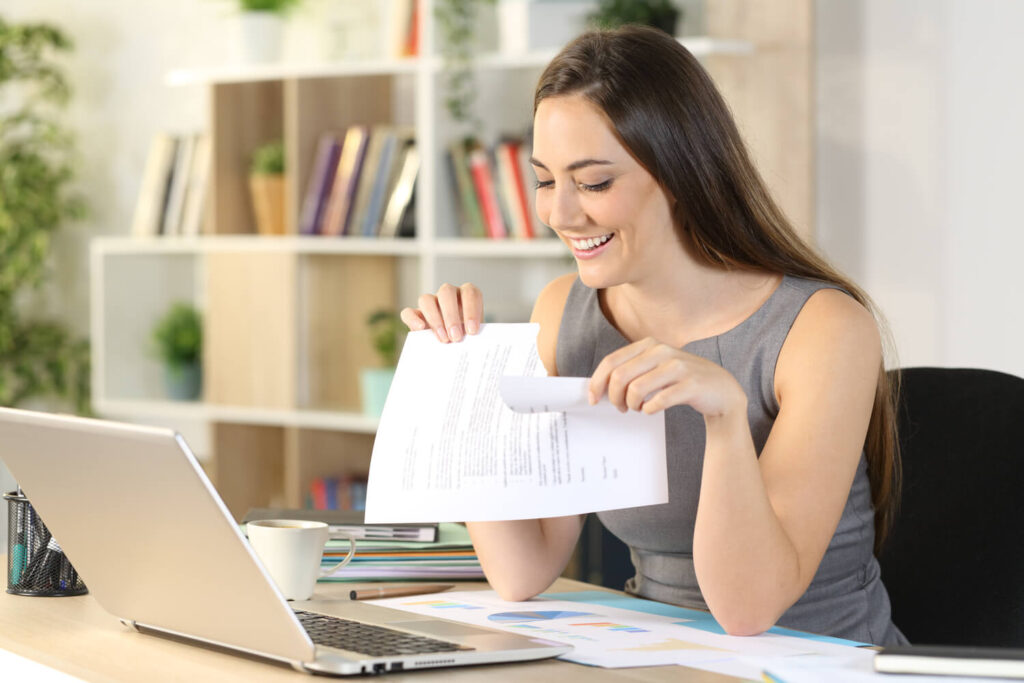 Woman smiling after cancelling her agreement | Why are timeshares so hard to get out of?