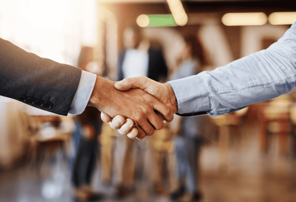 Two people shaking hands | Legitimate companies that buy timeshares