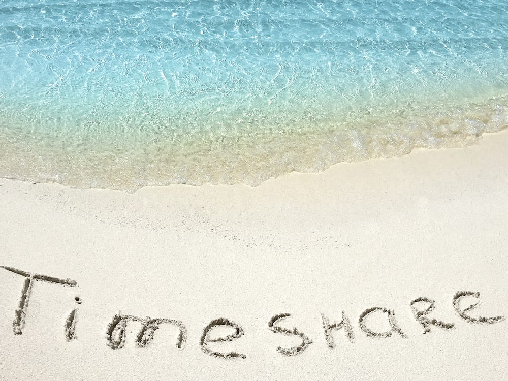 “Timeshare,” written in the sand | Florida Timeshare Cancellation