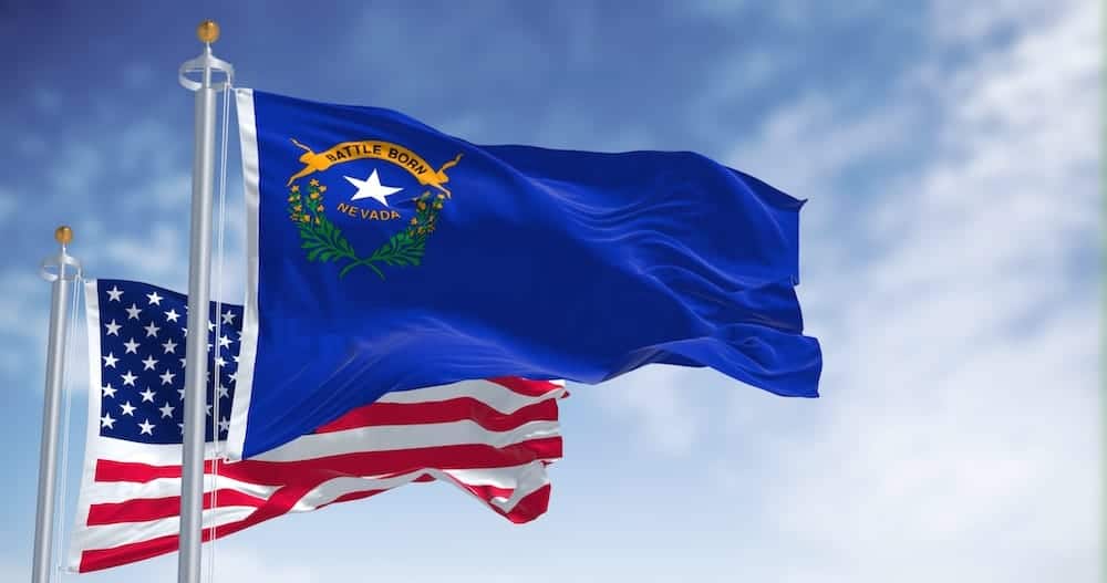 The Nevada State flag flying next to the American flag | Nevada Timeshare Cancellation