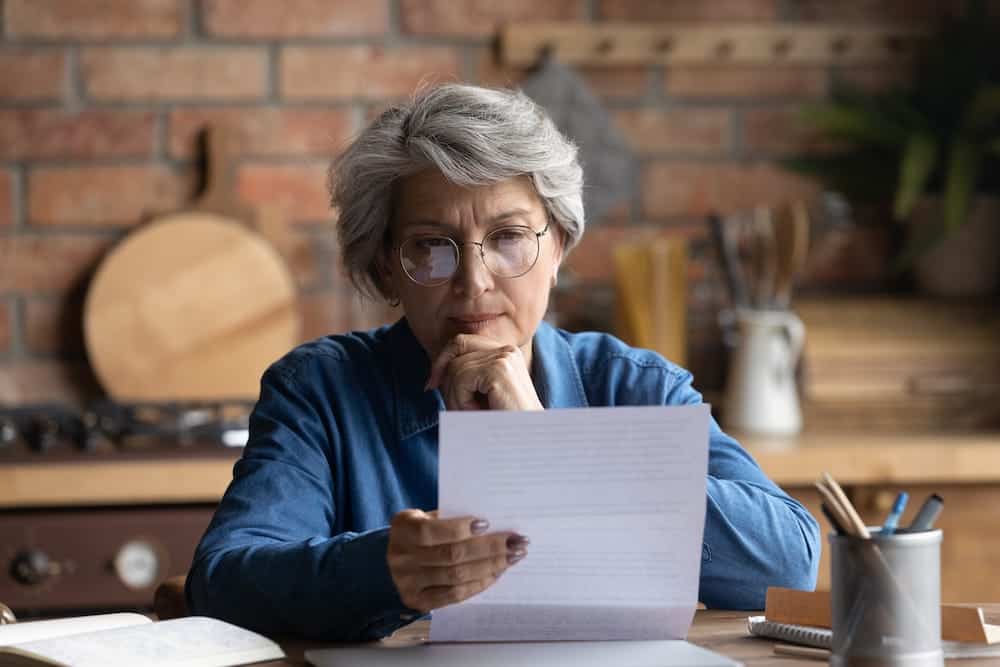 An older woman reviewing a document | Nevada Timeshare Cancellation 