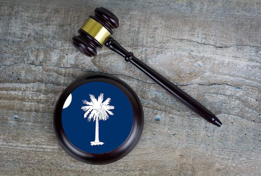 A gavel and block with the South Carolina palm tree logo | South Carolina Timeshare Cancellation Laws