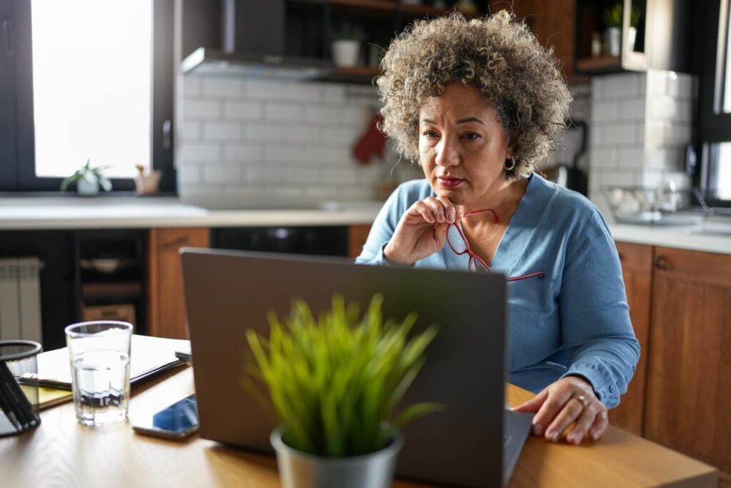 Older lady calculating whether she can afford cancellation | How to get out of a timeshare