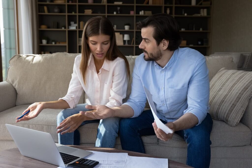 Young couple discussing their exit options | How to get out of a timeshare