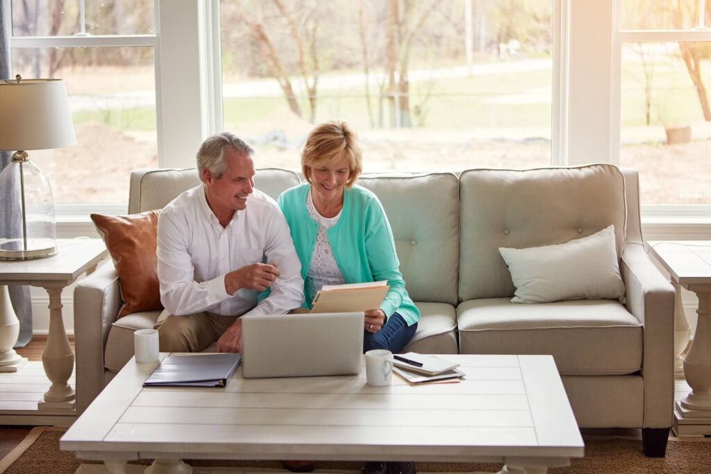 Senior couple reviewing maintenance fees | How to get out of a timeshare