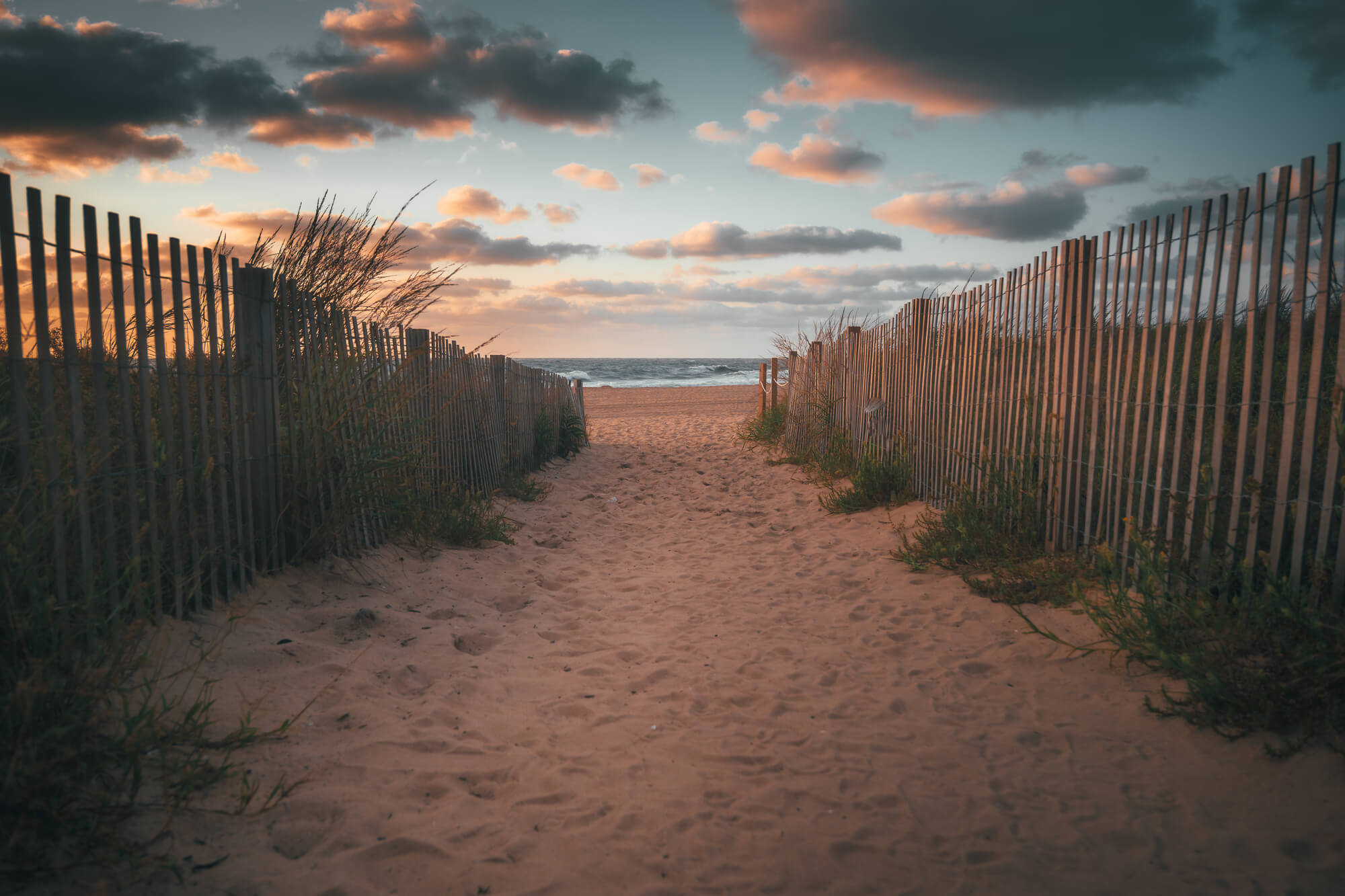 A sandy walkway down to the beach | Timeshare cancellation in Maryland