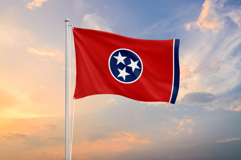 Tennessee state flag at sunset | Timeshare cancellation in Tennessee