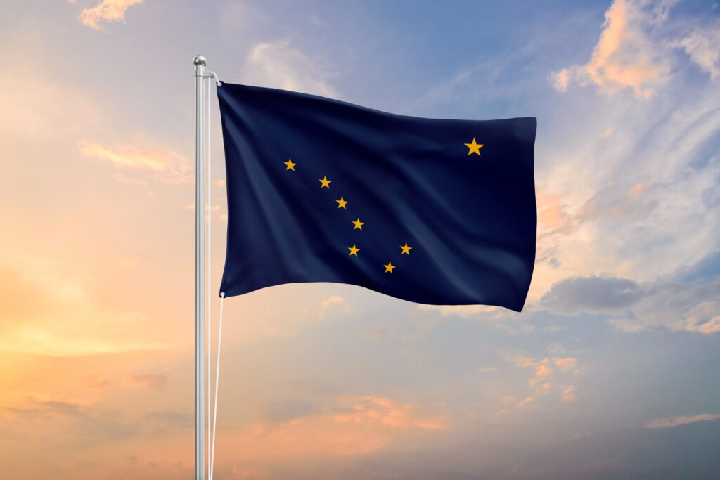 State flag waving during sunset | Timeshare cancellation in Alaska