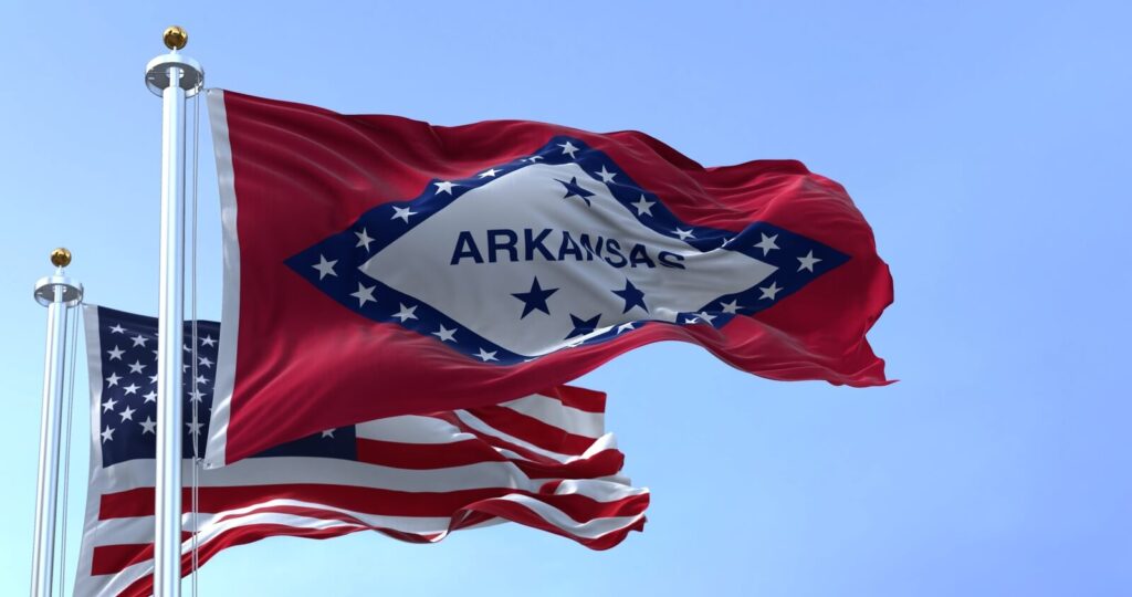 State flag blowing in the wind | Timeshare cancellation in Arkansas