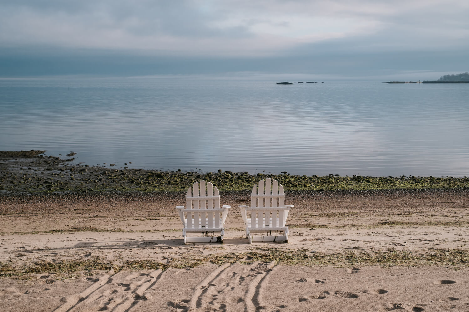 Chairs on a beach in the sand | Timeshare cancellation in Connecticut