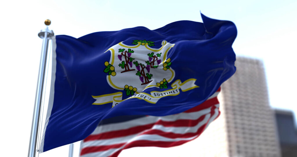 State flag waving in the wind | Timeshare cancellation in Connecticut