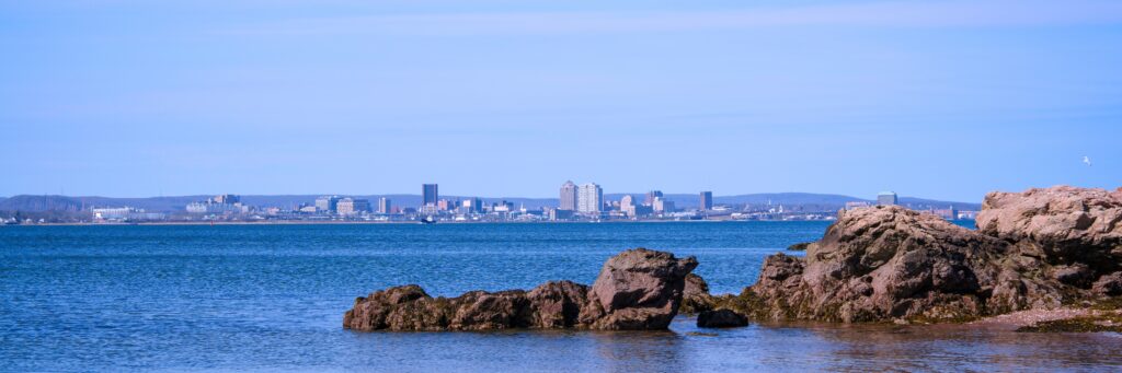 Tranquil harbor with rocks | Connecticut timeshare cancellation