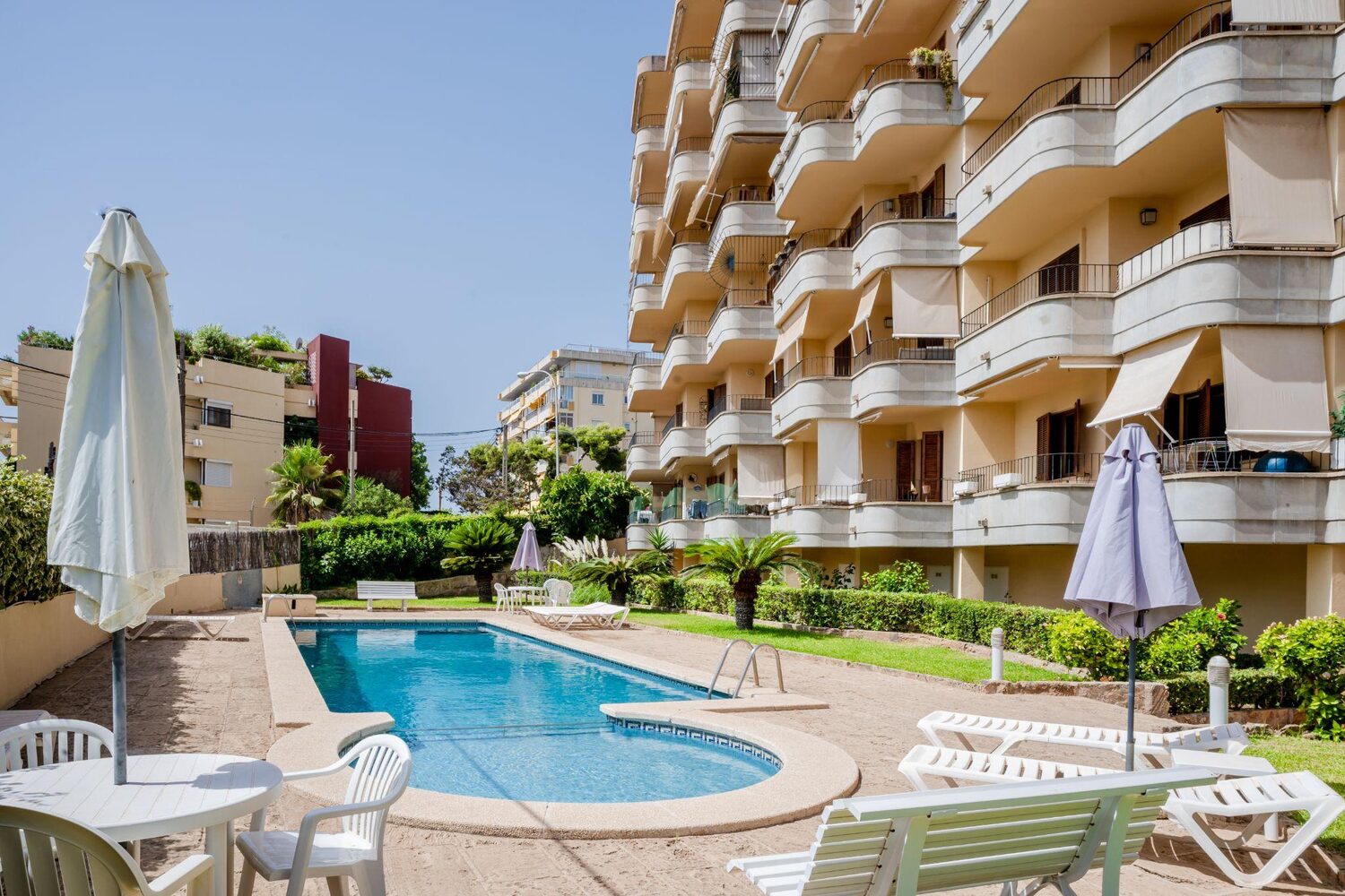 Resort pool area with lounge chairs | Best timeshare cancellation company
