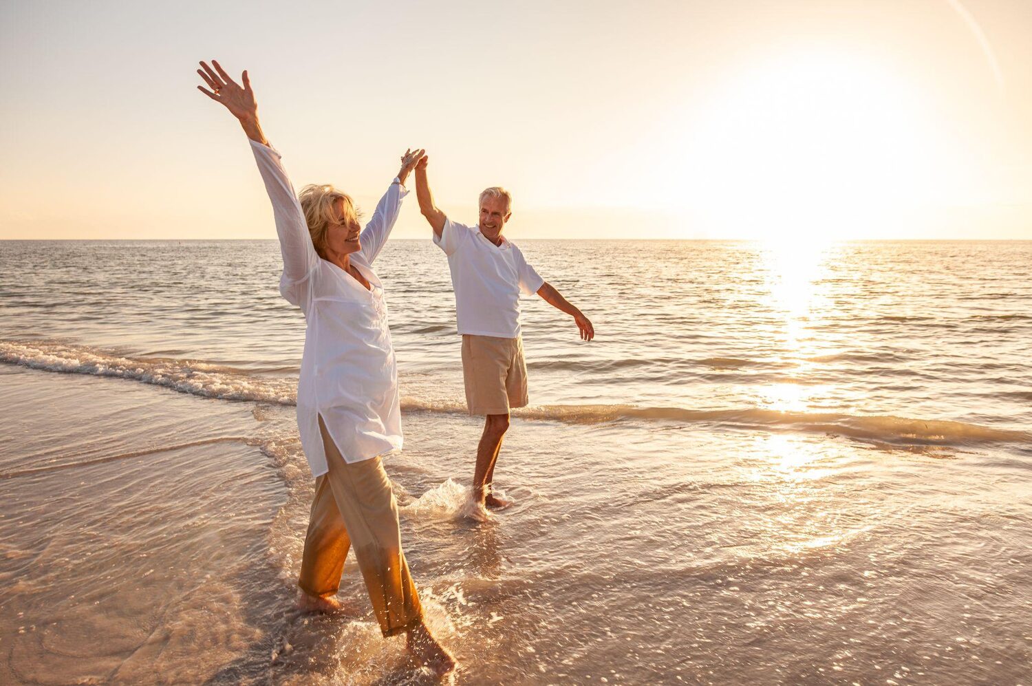 Senior couple walking on the beach | How much does it cost to get out of a timeshare?