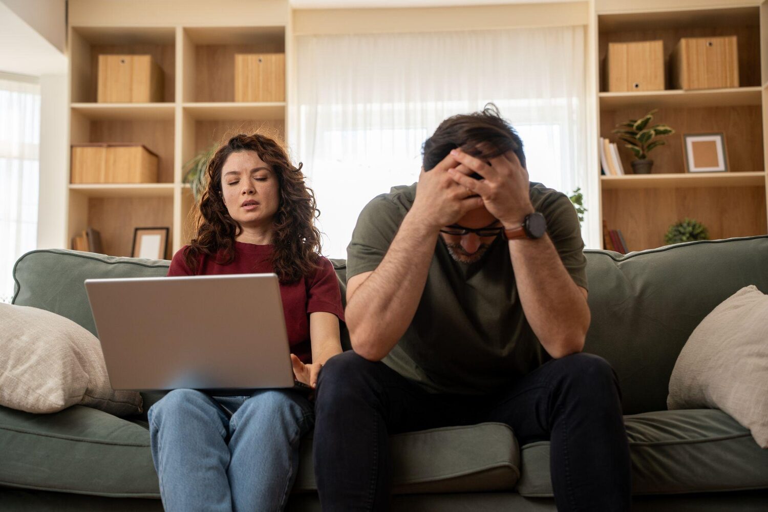 Stressed couple worrying about maintenance fees | What happens when you default on a timeshare?