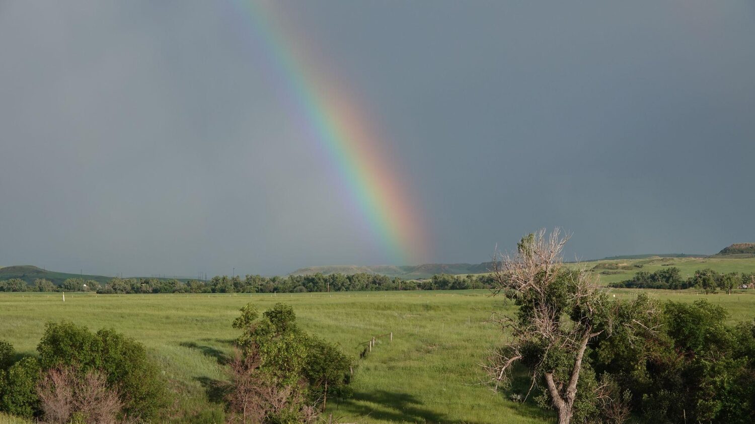 Rainbow over a field | North Dakota timeshare cancellation